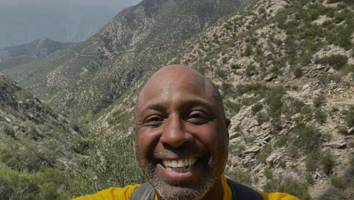 Frederick Johnson smiling on San Gorgonio Mountain during his fundraising hike